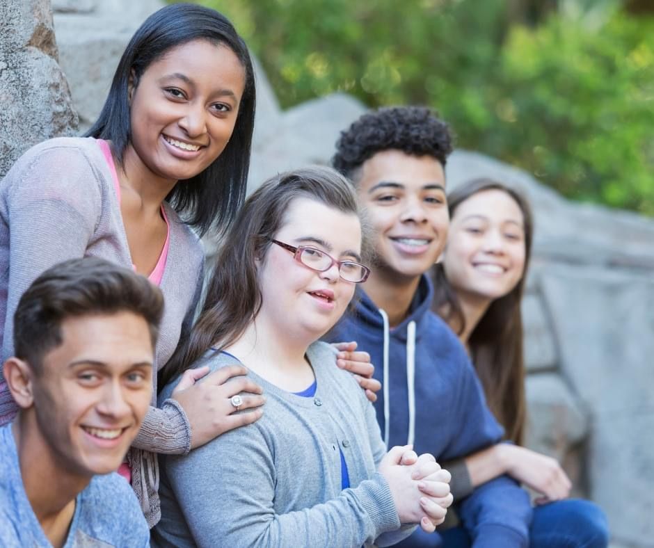 Diverse group of adults together in a supportive community setting